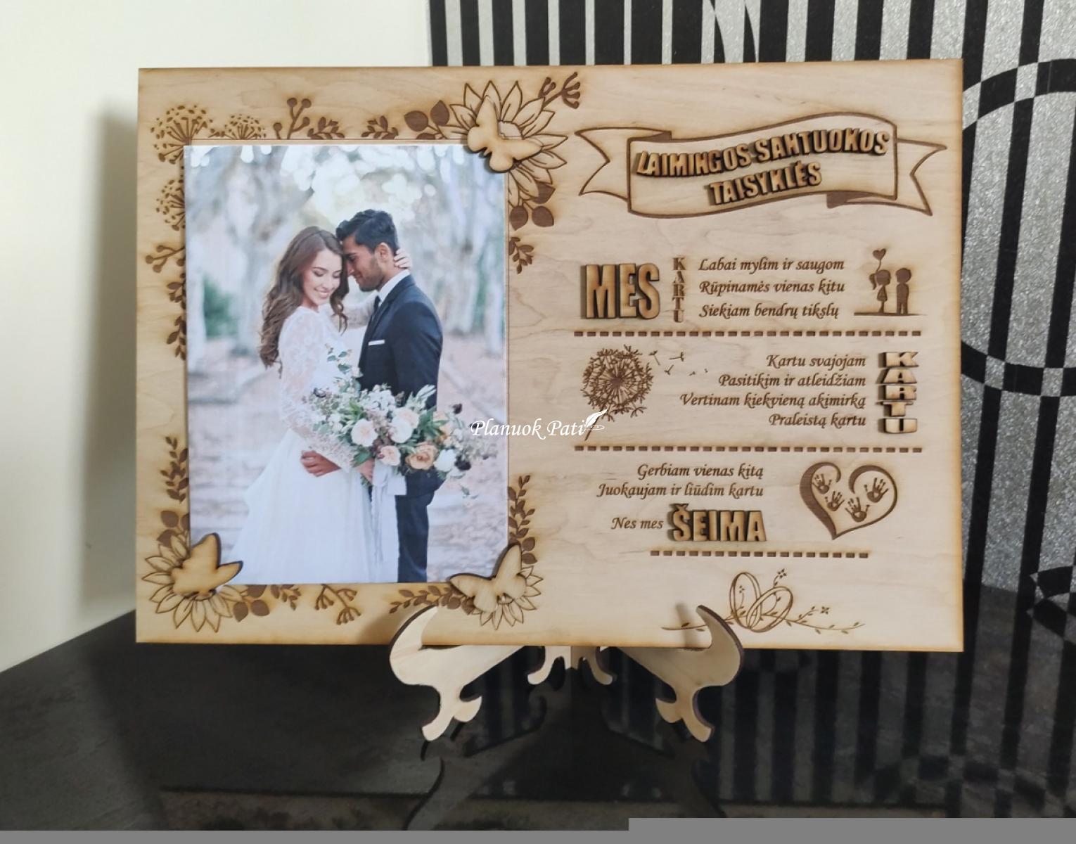 Rėmelis su laimingos santuokos taisyklėmis