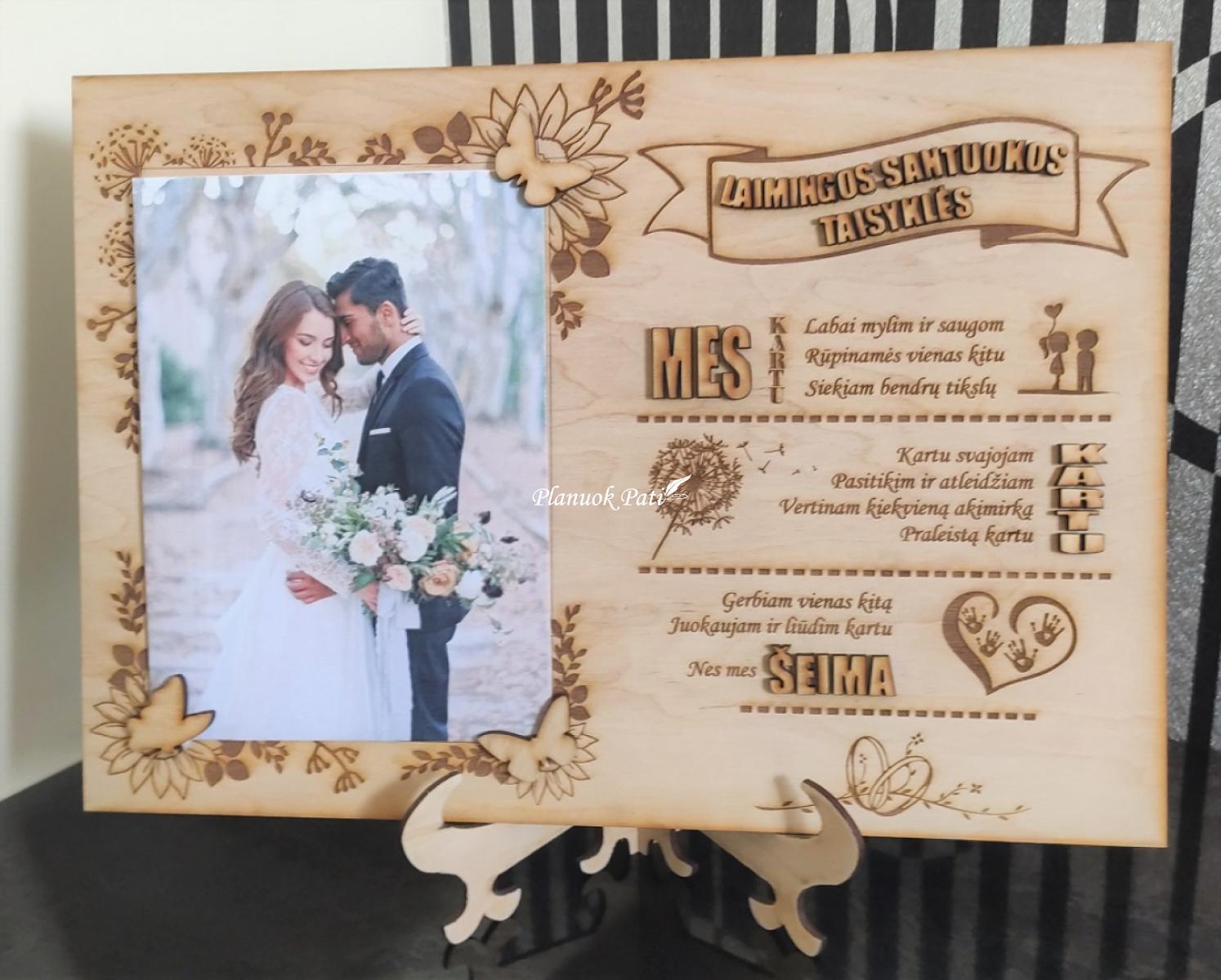 Rėmelis su laimingos santuokos taisyklėmis