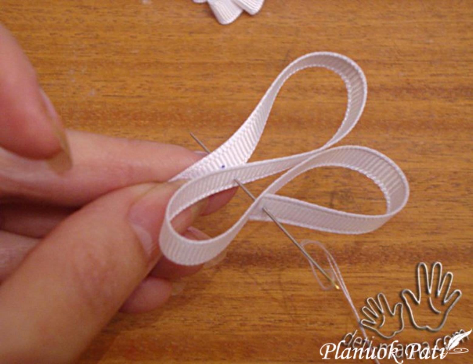 Drugelis iš kaspinėlio